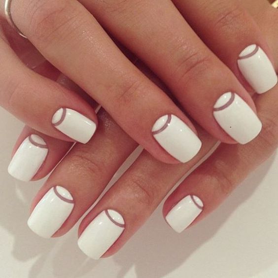 Simply stylish and easy white and negative space nail design