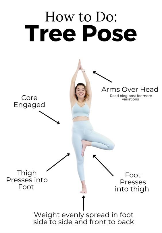 Woman Balancing Gracefully in Tree Pose (Vrksasana) with Hands Together at Center