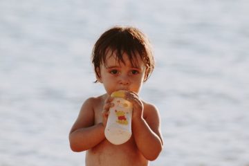 Toddler drinking immunity milk powder.